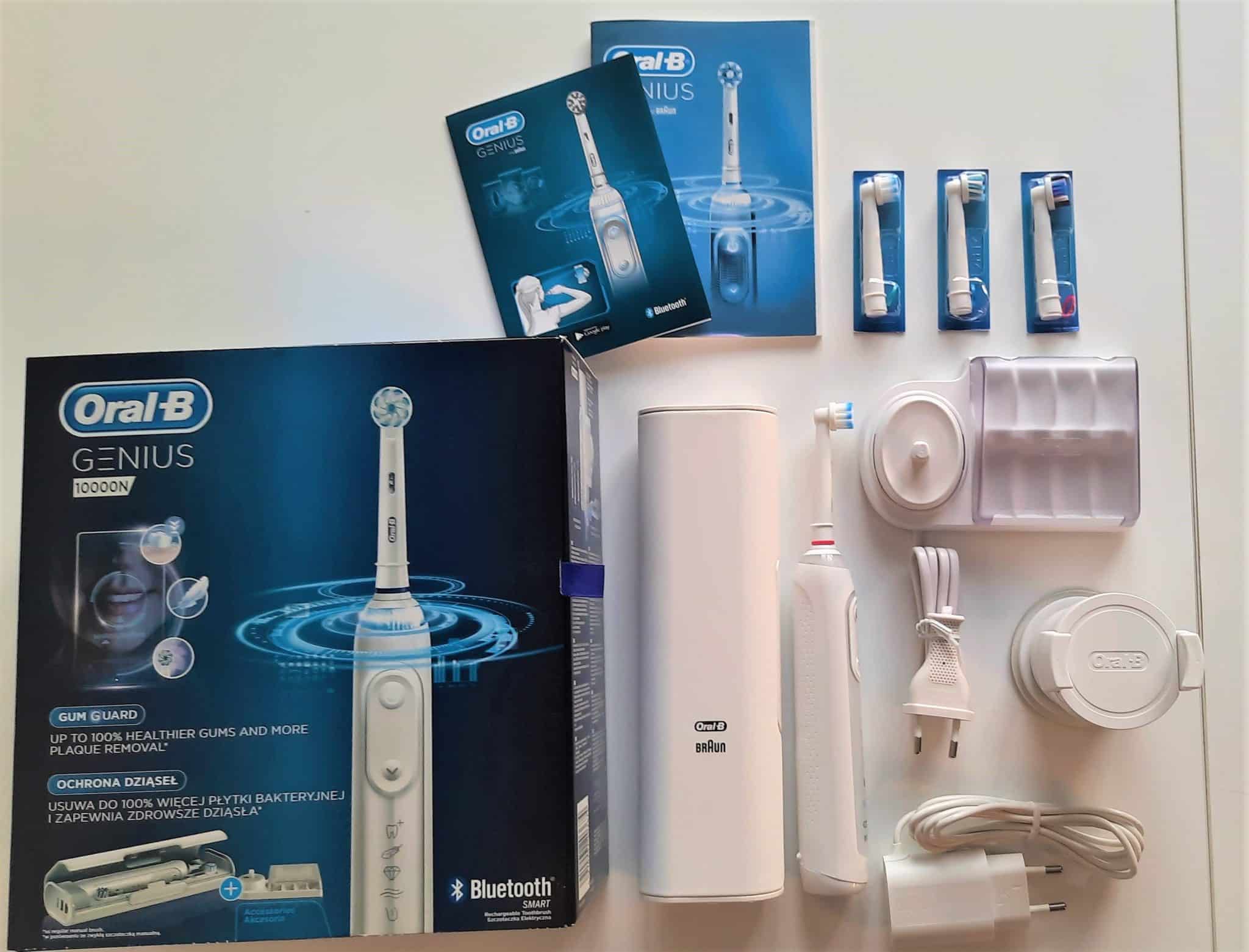 Zawartość pudełka Genius 10000N - rękojeść szczoteczki, uchwyt, etui, 4 końcówki, ładowarka, podstawka, pojemnik na końcówki i instrukcja obsługi